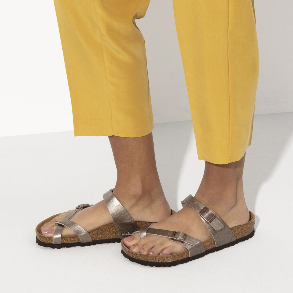 Model wearing Birkenstock Mayari Birko-flor Sandals in graceful taupe