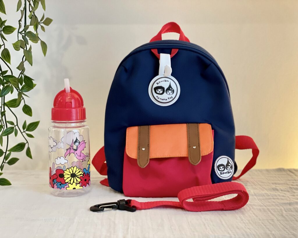 Zip and Zoe mini backpack in navy colourblock with straw water bottle