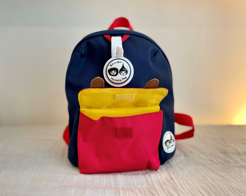 Zip and Zoe mini backpack in navy colourblock - front pocket
