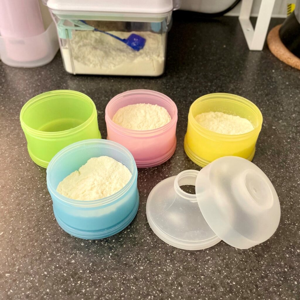 Milk powder dispenser containers - open showing the powder