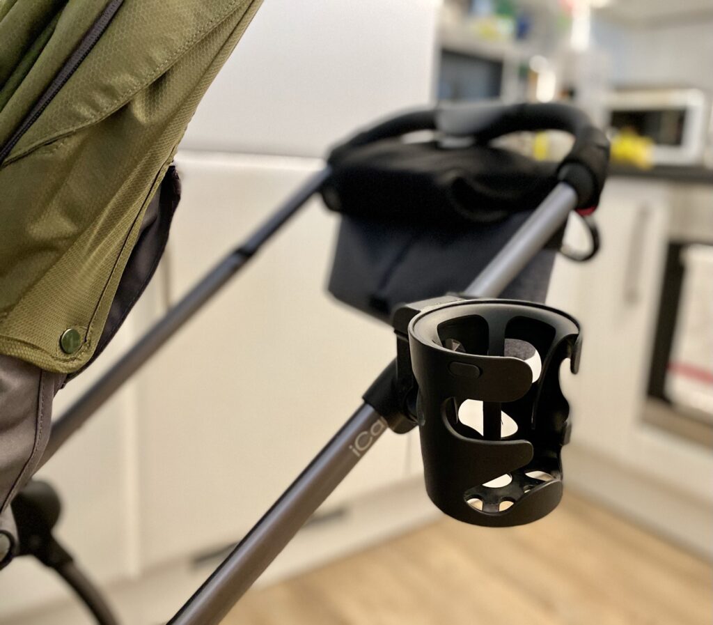 Author's iCandy universal cup holder attached to pushchair frame