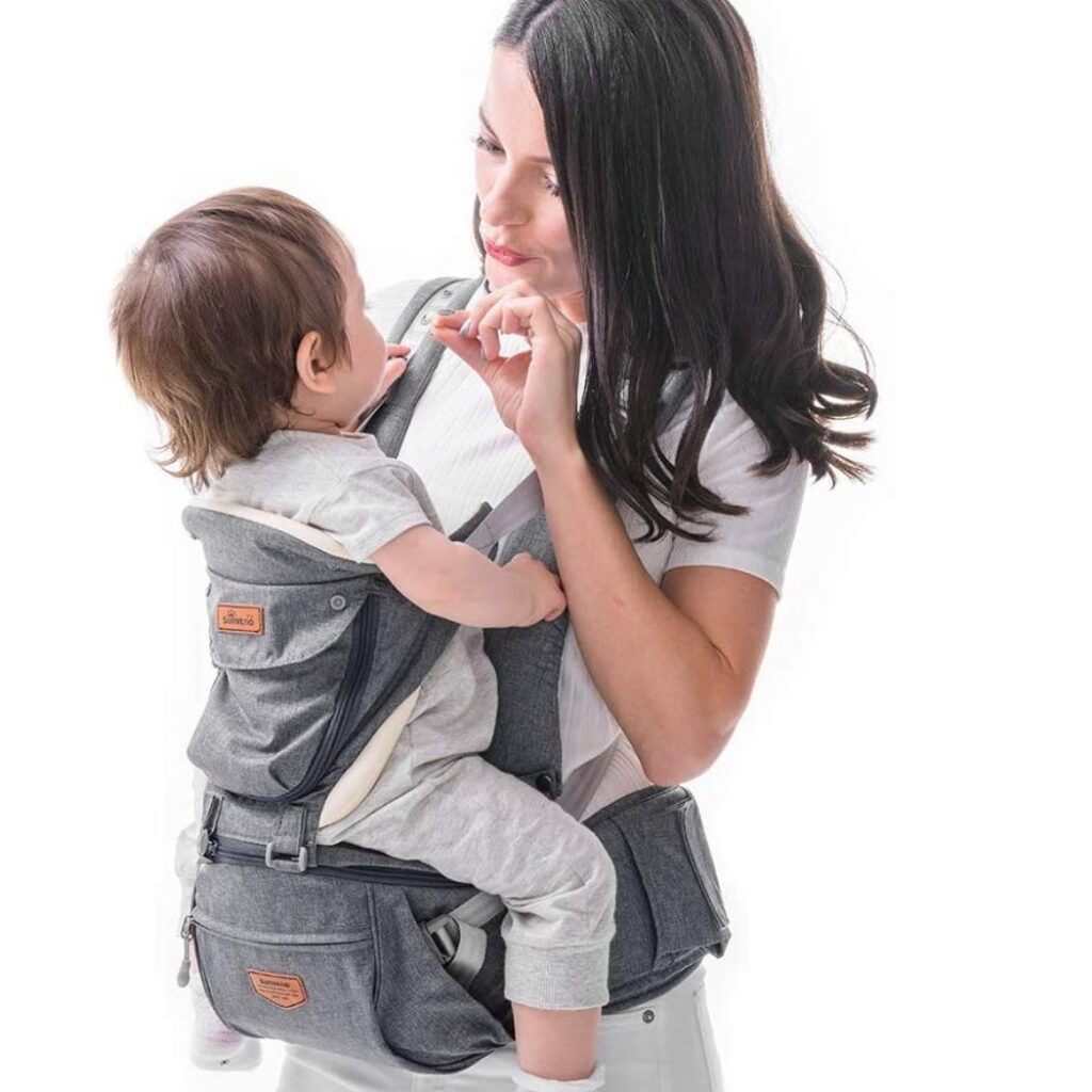 Model carrying baby in Sunveno baby carrier