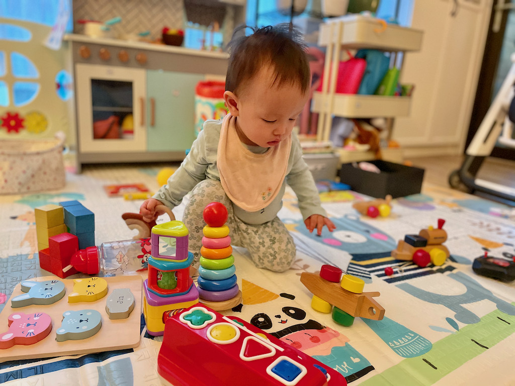 Boy playing with wooden toys