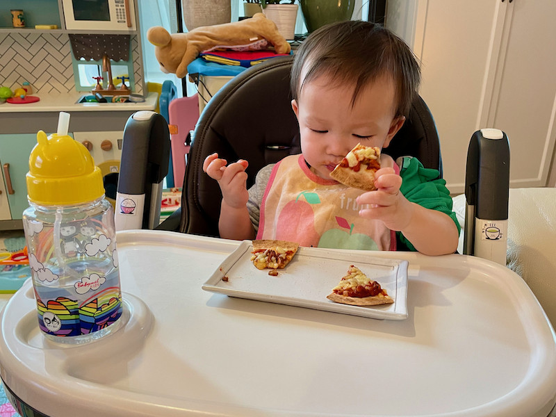 Boy eating tortilla pizza 1