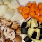 Chopped up onion, carrot, mushroom, aubergine
