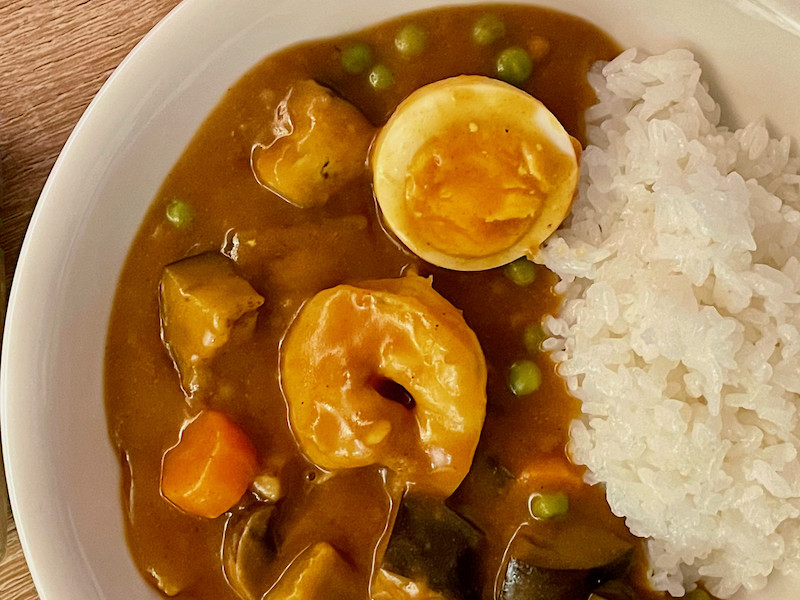 Japanese curry servies with prawn and boiled egg