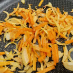 Step2 Add the carrot and fry with the onion