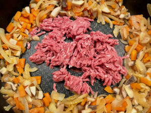 Step4 add beef to vegetables and fry