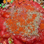Step6 add passata, herbs, paprika to meat and vegetables and stir