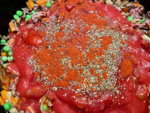 Step6 add passata, herbs, paprika to meat and vegetables and stir