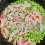 Step1 seafood sticks, peas, water and stock in a pan