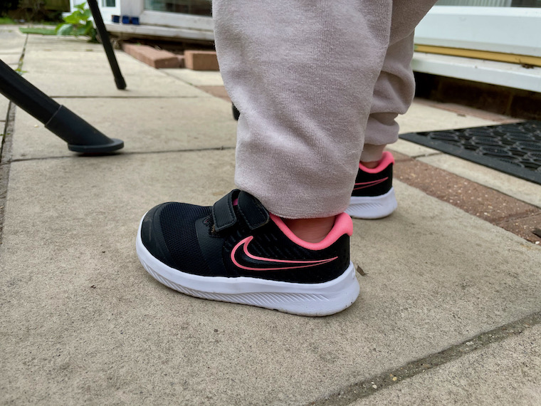 Boy wearing Nike Flex Runner close up one foot