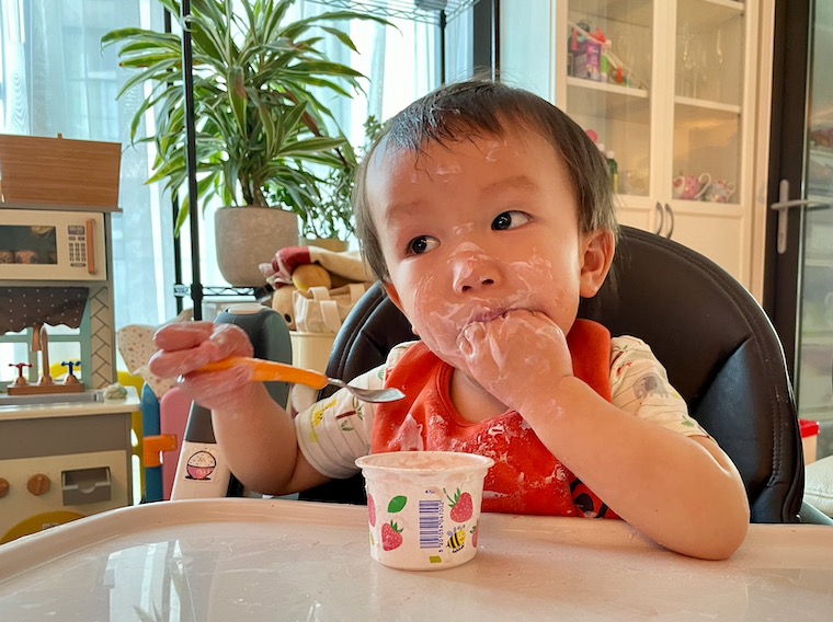 Boy eating yogurt - feature image